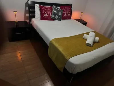 a bedroom with a bed with two towels on it at ARTEMIS HOUSe in Kakopetria