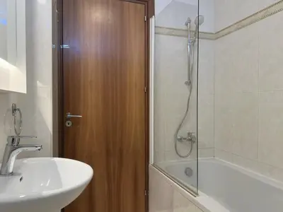 a bathroom with a sink and a shower with a sink at Breathtaking Sea and Marina View City Center 2 bdr in Larnaka