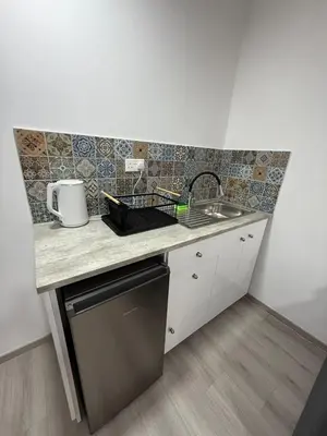 a small kitchen with a counter and a sink at Limassol center Soul in Limassol