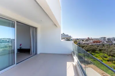 a balcony with a view of a city at BlueStar Limassol Suites in Limassol