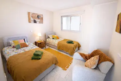 a living room with two beds and a couch at Mythical Sands 2 - G in Aglantzia