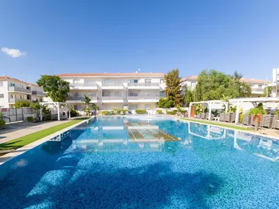 a large swimming pool in front of a building at Mythical Sands 2 - B in Paralimni