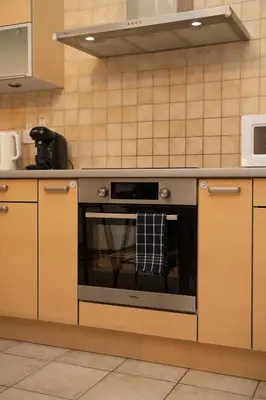 a kitchen with an oven with a towel on it at 2 bedroom flat in center in Nicosia