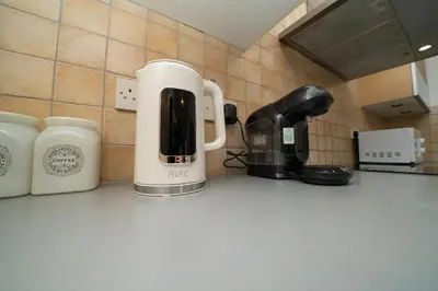 a coffeemaker sitting on top of a kitchen counter at 2 bedroom flat in center in Nicosia