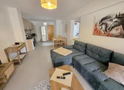 a living room with a couch and a table at Thea Court 3 - E in Paralimni