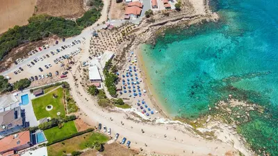 an aerial view of a beach with umbrellas and the ocean at Amore 1 - A in Paralimni
