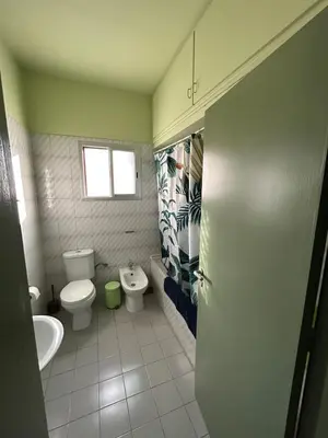 a bathroom with a toilet and a sink at Cozy flat by the sea with big pool tourist area in Limassol