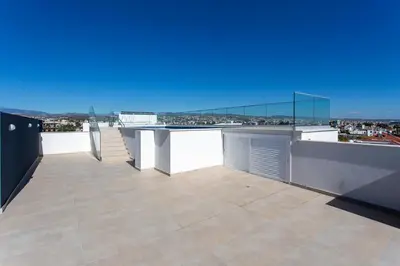 a balcony with a view of a city at BlueBell Limassol Suites in Limassol