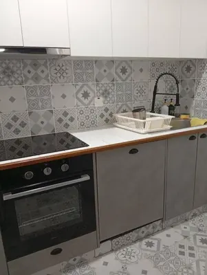 a kitchen with a stove and a counter top at En chirokitia cottages in Chirokitia