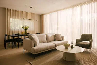 a living room with a couch and a table at Pinewood by Holistays in Engomi