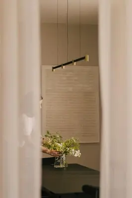 a vase of flowers on a table in a room at Pinewood by Holistays in Engomi