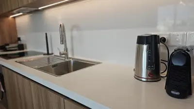 a coffeemaker sitting on a kitchen counter next to a sink at STAY Engomi Gem 1 in Engomi