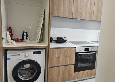 a kitchen with a washing machine in a kitchen at STAY Engomi Gem 1 in Engomi