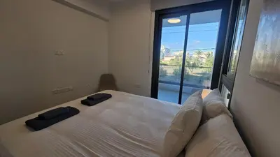 a bedroom with a large bed with two pillows on it at STAY Engomi Gem 1 in Engomi
