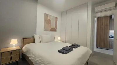 a bedroom with a bed with two towels on it at STAY Engomi Gem 1 in Engomi