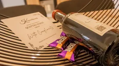a bottle of wine sitting on top of a bench at K-Apartments Managed by Quattro Forze Group in Larnaka