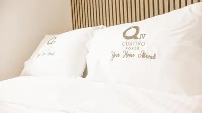 two pillows sitting on top of a bed at K-Apartments Managed by Quattro Forze Group in Larnaka
