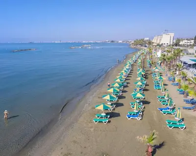 an overhead view of a beach with chairs and umbrellas at Modern & Fancy ground floor Studio - Pool & Relax in Tersephanou