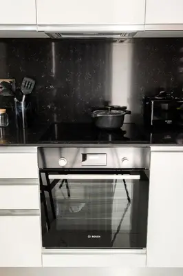 a kitchen with a stove with a pan on it at Cozy 1BR Apartment with Terrace in Phrenaros