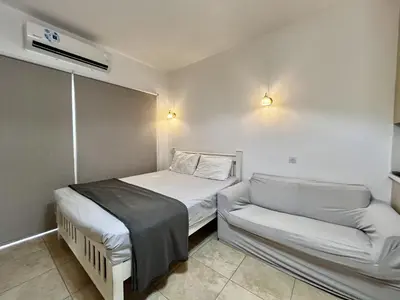 a small room with a bed and a couch at STAY Sunsea Studio in Limassol