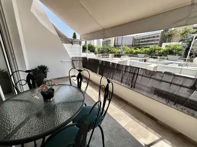 a table and chairs on a balcony with a view at STAY Sunsea Studio in Limassol
