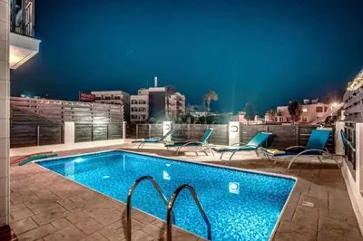 a swimming pool on the roof of a building at Pernera Sunrise Villa in Paralimni