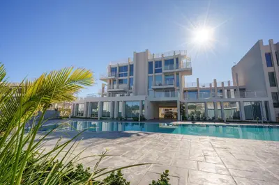 a large apartment building with a swimming pool at Blue Horizon Seaview Suite with Rooftop and Pool in Paralimni in Paralimni