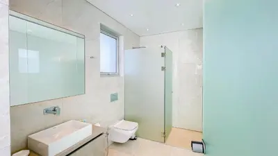 a bathroom with a sink and a toilet and a shower at Villa Cielo Mare in Ayia Napa