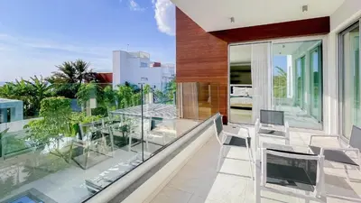 a balcony of a house with glass railing at Villa Cielo Mare in Ayia Napa