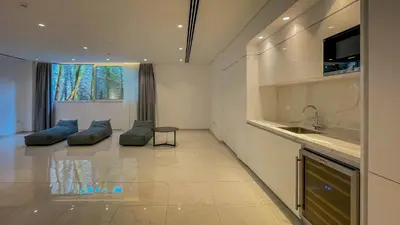 a kitchen and living room with a couch and a sink at Villa Cielo Mare in Ayia Napa