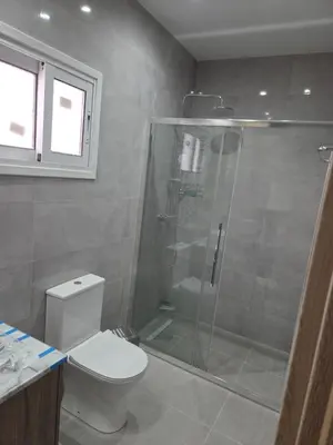 a bathroom with a shower and a toilet at Selladi Mountain Escape in Ephtagonia