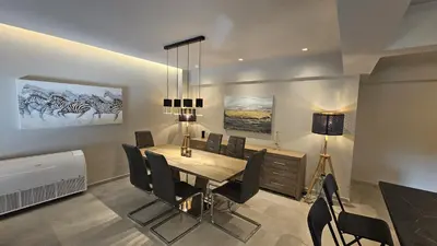 a dining room with a table and chairs at STAY Executive Retreat in Nicosia