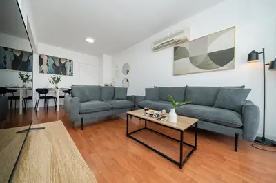 a living room with two couches and a coffee table at 1 bedroom flat in Nicosia