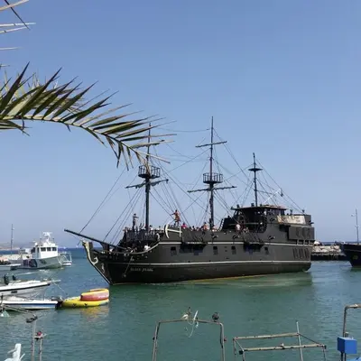 a large ship is docked in the water at Summer Breeze apt by Nissi Beach in Ayia Napa