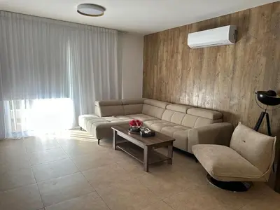 a living room with a couch and a table at CityLink-3Bedrooms Appartment CityCenter in Limassol