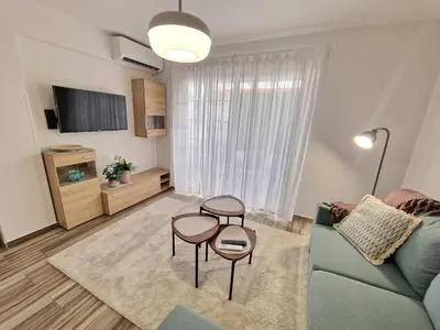 a living room with a couch and two tables at 1, bed Kapparis, Triumph 1 - A in Paralimni