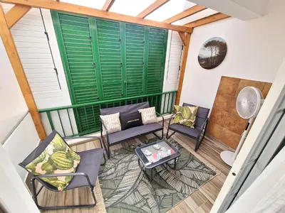 an attic balcony with chairs and a table at 1, bed Kapparis, Triumph 1 - A in Paralimni