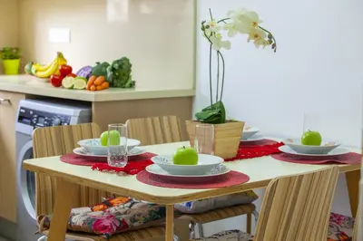 a kitchen table with two plates of food on it at Omerou Apartment in Nicosia
