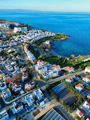 an aerial view of a city next to the ocean at Modern 2BR Villa with Heated Hot Tub and Steps to Beach in Paralimni