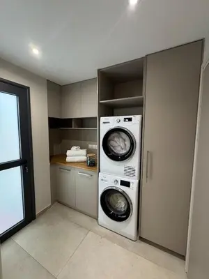 a laundry room with a washer and dryer in it at Loft 17 - fully renovated loft in centre in Limassol