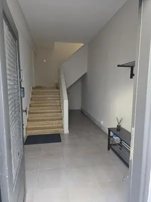 an empty hallway with stairs and a stair case at Loft 17 - fully renovated loft in centre in Limassol