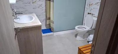 a bathroom with a toilet and a sink at The river house in Kato Pyrgos