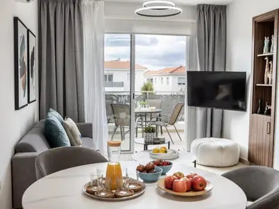 a living room with a table with fruit on it at Mythical Sands AL14 in Paralimni