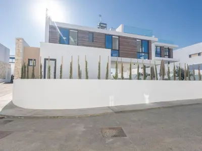 a building with a white fence in front of it at Holiday Home Protaras Aqua Pearl Villa AQ16 by Interhome in Protaras