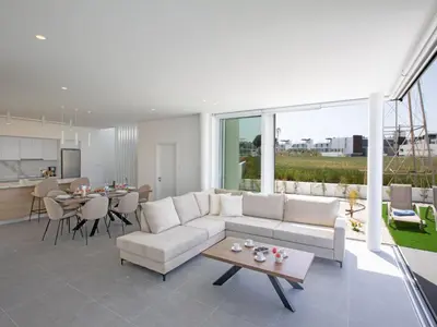 a living room with a couch and a table at Holiday Home Bleu Vie in Protaras by Interhome in Protaras