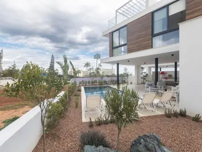 an exterior view of a house with a swimming pool at Holiday Home Protaras Aqua Pearl Villa AQ01 by Interhome in Protaras
