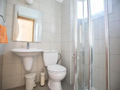 a bathroom with a toilet and a sink and a shower at Holiday Home in Protaras mit privatem Parkplatz by Interhome in Protaras