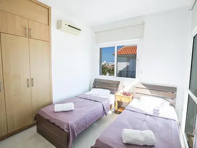 two beds in a room with a window at Holiday Home in Protaras mit privatem Parkplatz by Interhome in Protaras