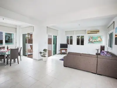 a living room with a couch and a table at Holiday Home in Protaras mit privatem Parkplatz by Interhome in Protaras