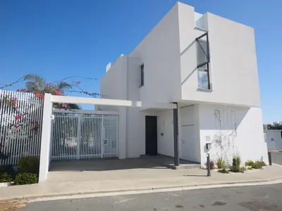 a white house on a street at Holiday Home Protaras Almaria Villa ALM08 by Interhome in Protaras
